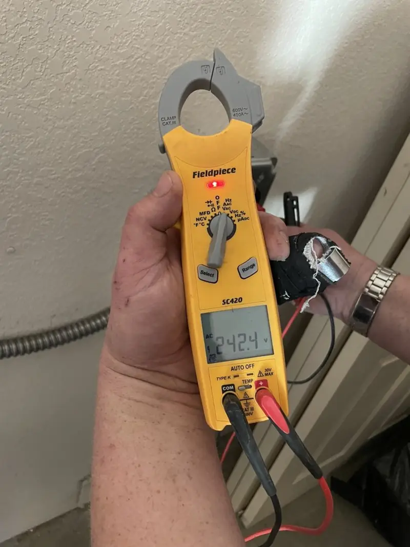 Voltage testing with clamp meter during Generator Installation in Eagle Lake